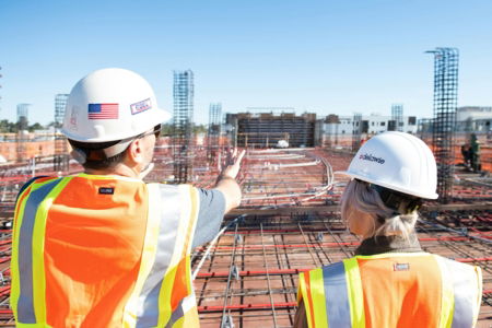 man-in-white-hard-hat-standing-on-brown-wooden-dock-during-daytime.jpg man in white hard hat standing on brown wooden dock during daytime